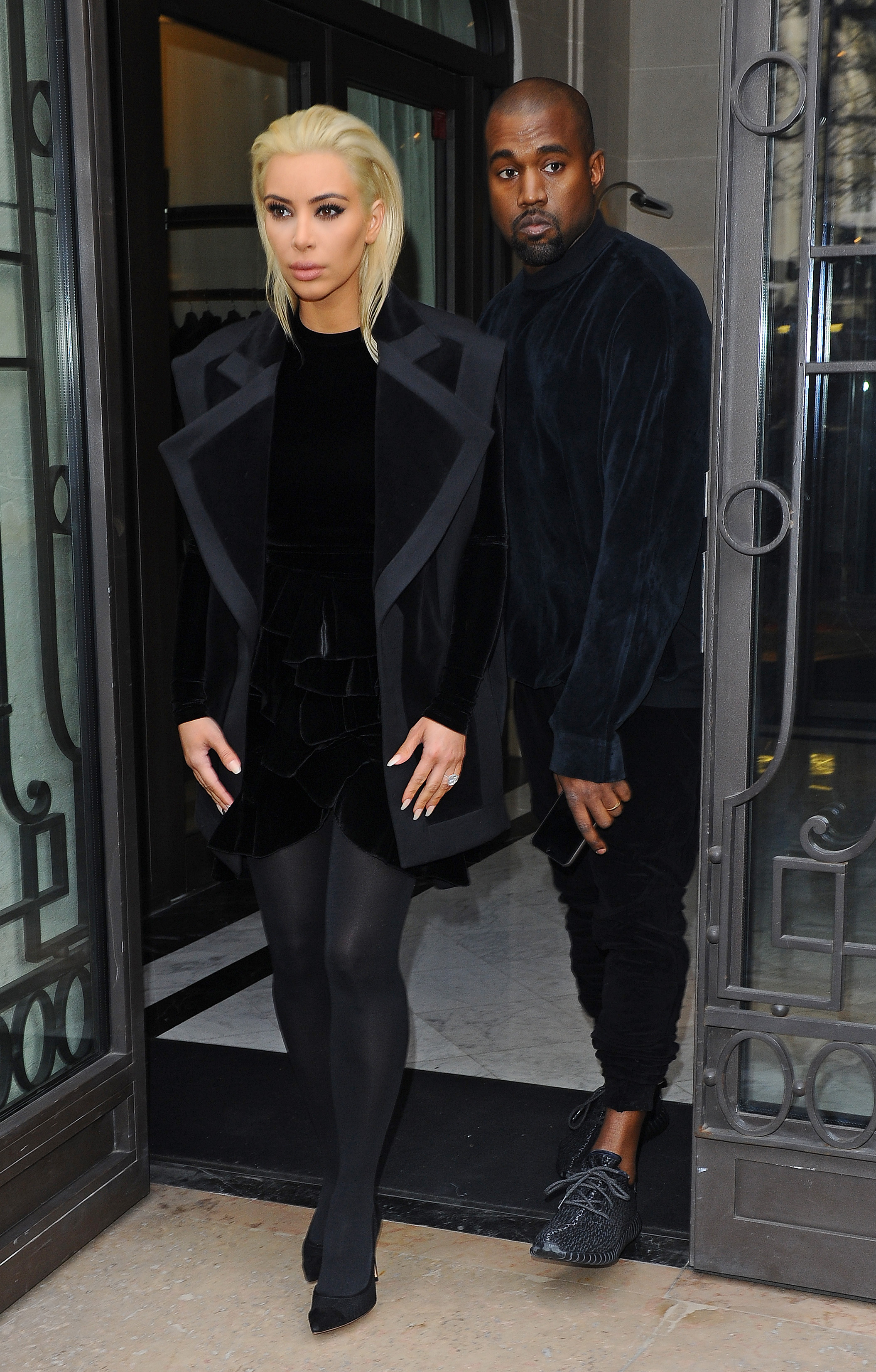 A blonde Kim Kardashian and husband Kanye West seen heading to the Balmain fashion show