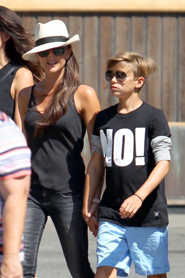 David and Victoria Beckham enjoy a day at Disneyland with their chilren
