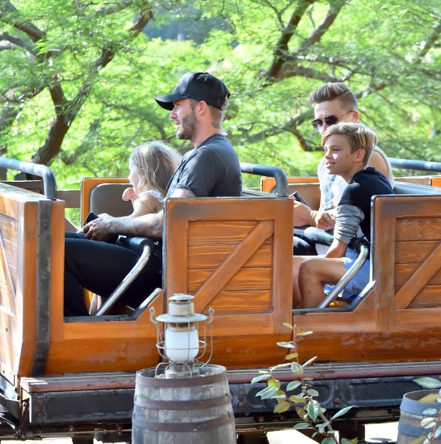 EXCLUSIVE: David Beckham takes a selfie with his daughter Harper as they ride Big Thunder Mountain Railroad at Disneyland