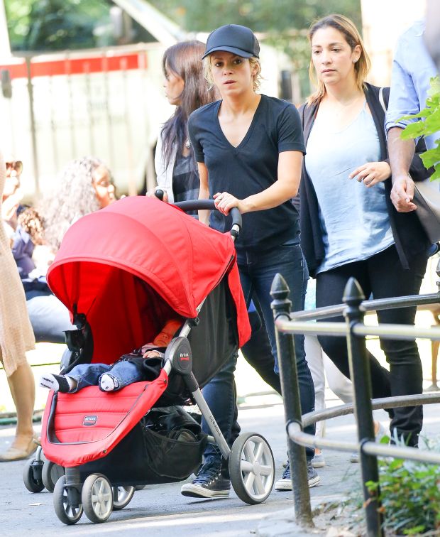 EXCLUSIVE: Shakira spotted trying to keep her balance while carrying her son Sasha and talking on her cellphone while they where in Central Park in New York City