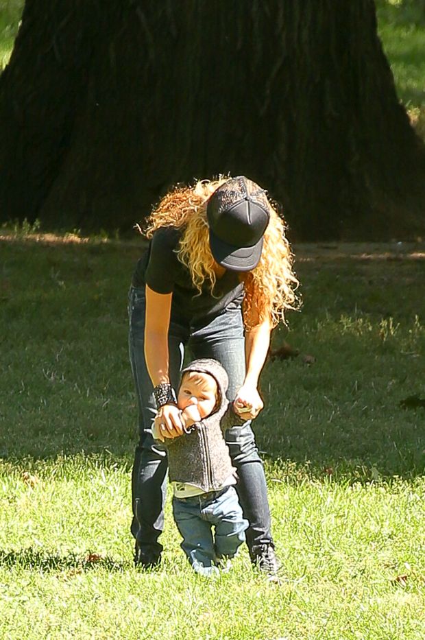 EXCLUSIVE: Shakira spotted trying to keep her balance while carrying her son Sasha and talking on her cellphone while they where in Central Park in New York City
