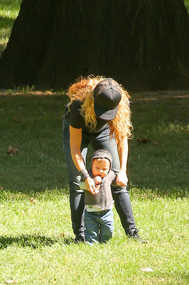 EXCLUSIVE: Shakira spotted trying to keep her balance while carrying her son Sasha and talking on her cellphone while they where in Central Park in New York City