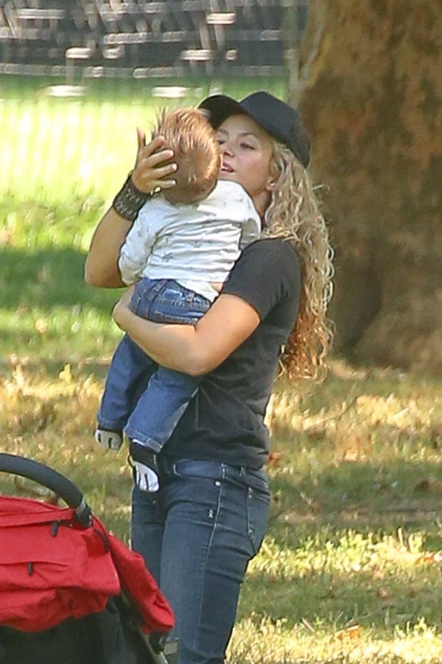 EXCLUSIVE: Shakira spotted trying to keep her balance while carrying her son Sasha Piquι Mebarak and talking on her cellphone while they where in Central Park in New York City Part 2
