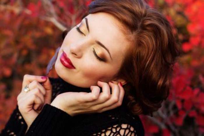 Pretty woman in autumn park