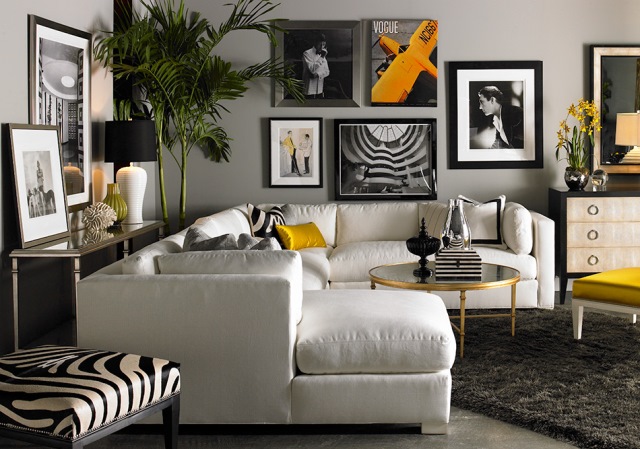 Μοντέρνο decor με γωνιακό καναπέ ο οποίος οριοθετεί το χώρο του καθιστικού.