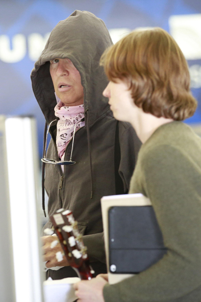 EXCLUSIVE: ****PREMIUM EXCLUSIVE RATES APPLY*** A rare Val Kilmer is spotted with his 20-year-old son, Jack Kilmer as it's reported as questions about the actor's health continue. The iconic "Batman" and "Top Gun" actor was seen at LAX catching a flight out of town with his son. Val Kilmer was seen wearing a hoodie and a scarf as he made his way through TSA at LAX. Pictured: Val Kilmer, Jack Kilmer Ref: SPL1109047 240815 EXCLUSIVE Picture by: Diabolic / Sharky / Splash News Splash News and Pictures Los Angeles:310-821-2666 New York:212-619-2666 London:870-934-2666 photodesk@splashnews.com 