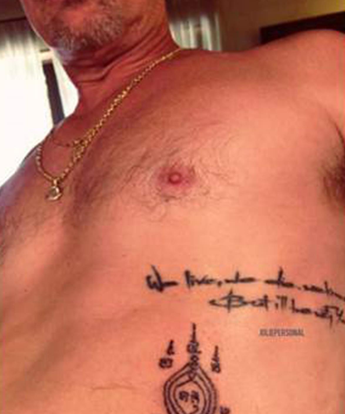 1454647389898_Brad-Pitt-tattoo_0eeab