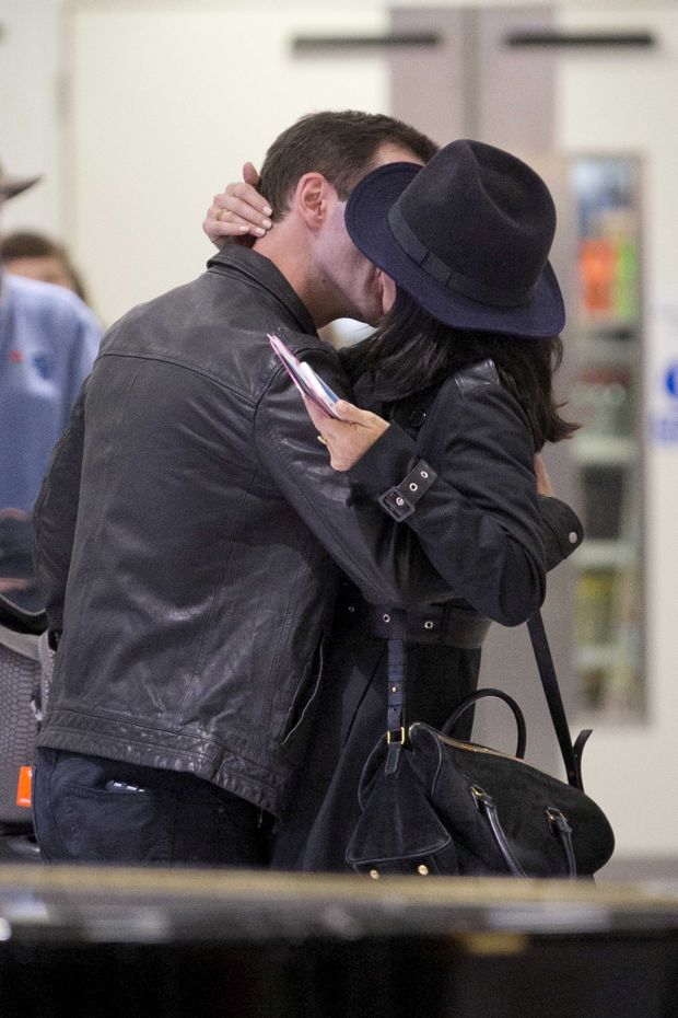 EXCLUSIVE: Courteney Cox and Johnny McDaid are back on as the pair kiss at Heathrow airport this afternoon.