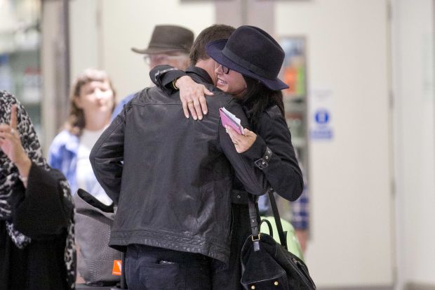 EXCLUSIVE: Courteney Cox and Johnny McDaid are back on as the pair kiss at Heathrow airport this afternoon.