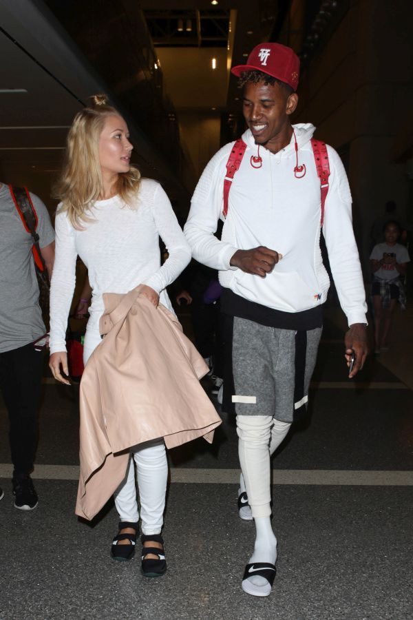 Iggy Azalea and fiancι Nick Young head thru LAX bound for Australia