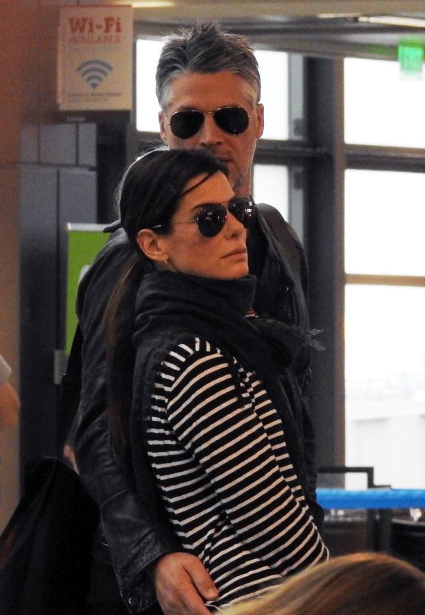 EXCLUSIVE: ** PREMIUM EXCLUSIVE RATES APPLY**  Sandra Bullock and boyfriend Bryan Randall looking very much in love as they get food at Austin airport before heading back to Los Angeles