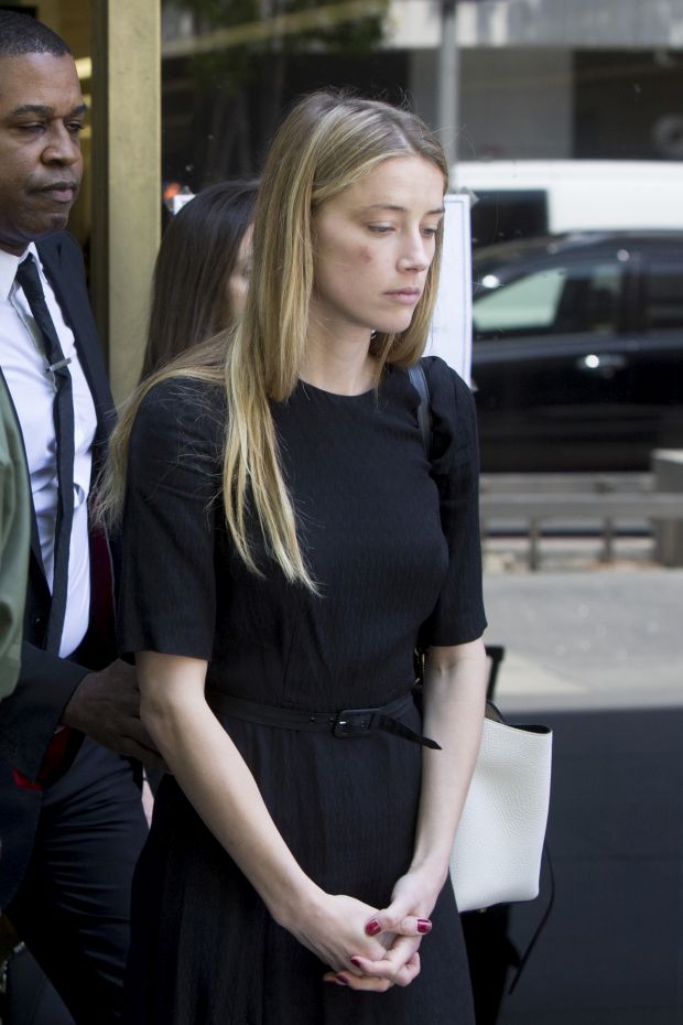 Amber Heard leaves court in Downtown Los Angeles,CA after a temporary restraining order against Johnny Depp was granted.