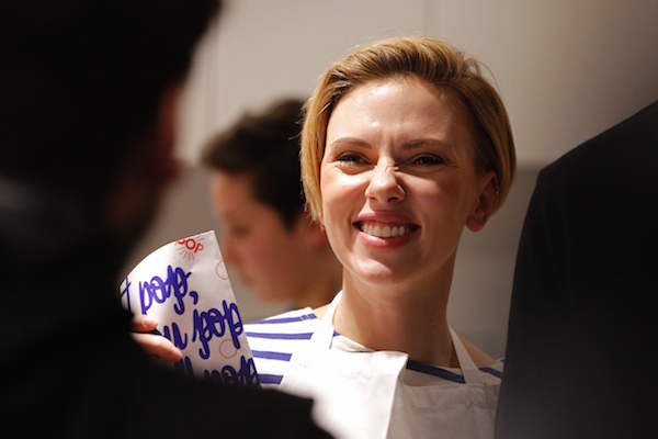 US actress Scarlett Johansson smiles at the opening of the Yummy Pop gourmet popcorn shop in the Marais district of Paris on October 22, 2016. The concept is a labour of love with her French husband, advertising executive Romain Dauriac. And the couple hope that if their "Real Vermont Cheddar" and other savoury and sweet recipes are a hit, they will open other shops elsewhere. / AFP / Benjamin CREMEL