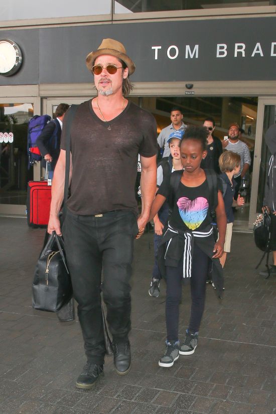 Angelina Jolie and Brad Pitt walk through LAX with all their kids