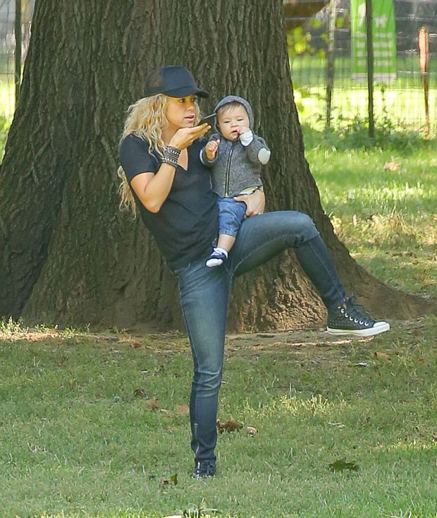 EXCLUSIVE: Shakira spotted trying to keep her balance while carrying her son Sasha and talking on her cellphone while they where in Central Park in New York City