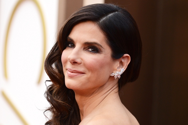 Sandra Bullock arrives at the Oscars on Sunday, March 2, 2014, at the Dolby Theatre in Los Angeles. (Photo by Jordan Strauss/Invision/AP)