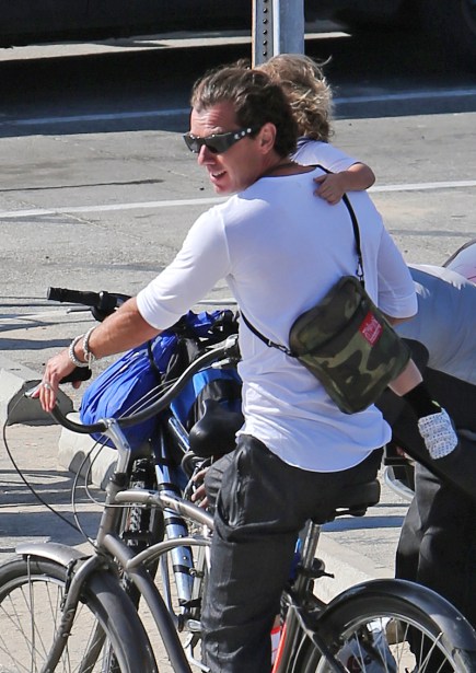 EXCLUSIVE: ** PREMIUM EXCLUSIVE RATES APPLY** Gavin Rossdale takes his 2 year-old son Apollo for a bike ride without a helmet!