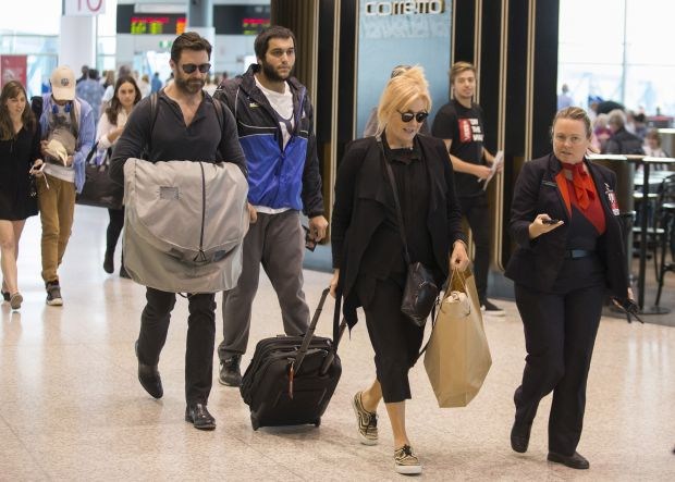 Hugh Jackman jets into Sydney with his whole family in tow.