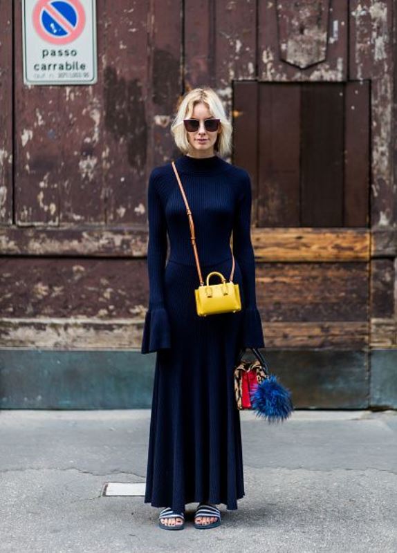 MILAN, ITALY - SEPTEMBER 21: Lisa Hahnbueck (@lisarvd) wearing a backless Knitdress with big sleeves H&M Trend, Milla Gepard Tote Mini + Milla Micro Bag / X-Mini, adiletten, Fendi sunglasses  is seen outside Alberta Ferretti during Milan Fashion Week Spring/Summer 2017 on September 21, 2016 in Milan, Italy. (Photo by Christian Vierig/Getty Images) *** Local Caption *** Lisa Hahnbueck
