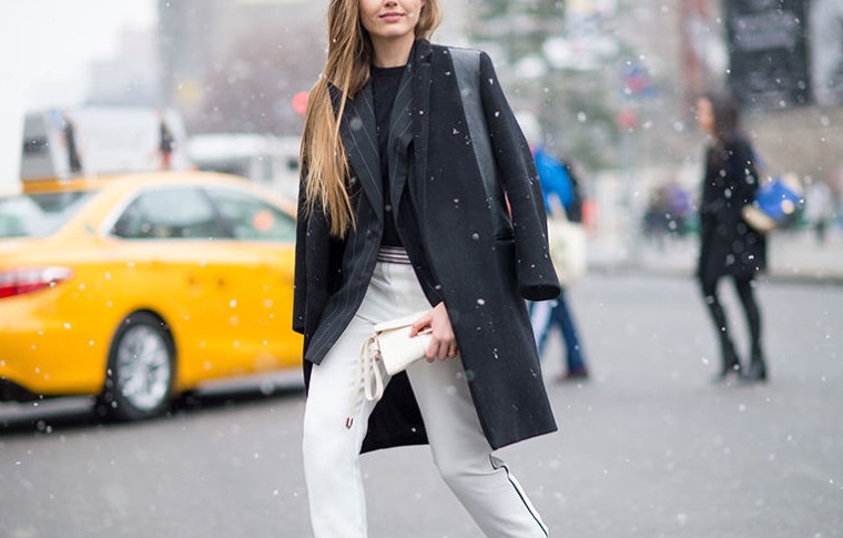 nyfw-winter-layers-freezing-elle-pinstripes-pinstripe-blazer-white-pants-winter-whites-tuxedo-pants-jacket-on-shoulder-black-coat-black-ankle-boots